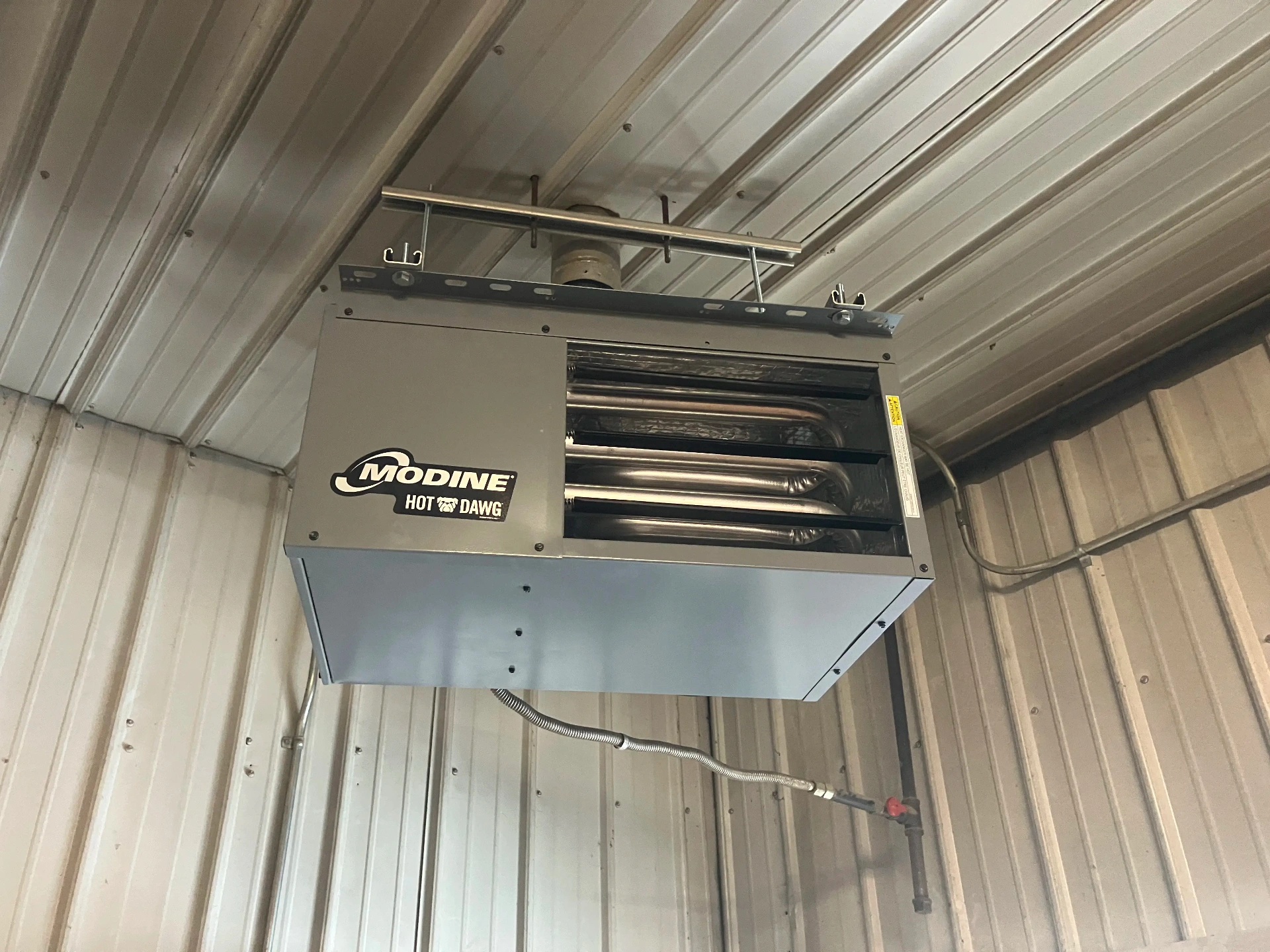 Modine unit heater installation and repair service in commercial garage by East to West HVAC